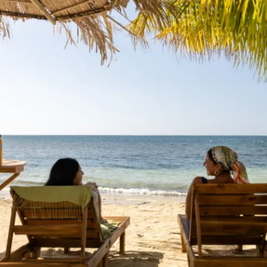 Experiences girls in beach chair facing the ocean2